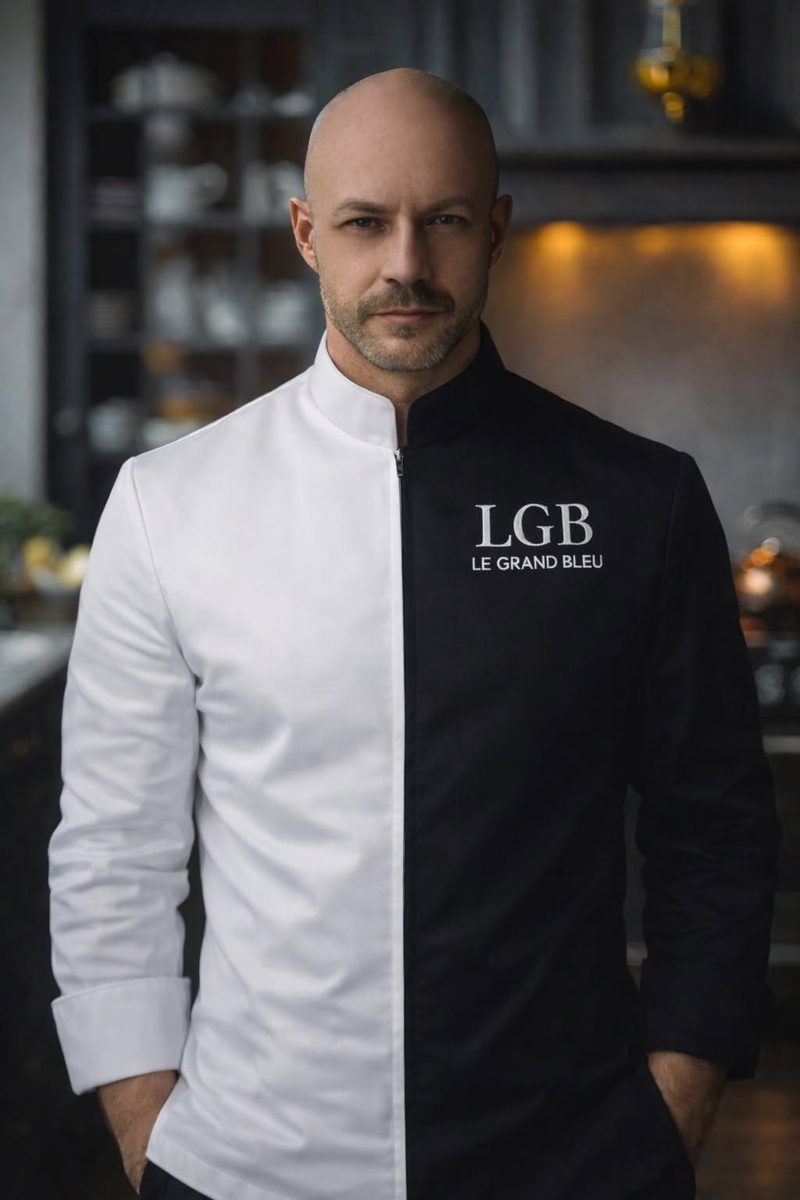 Dan McCarthy in a white and black Le Grand Bleu chef's jacket